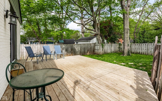 deck with a fenced backyard