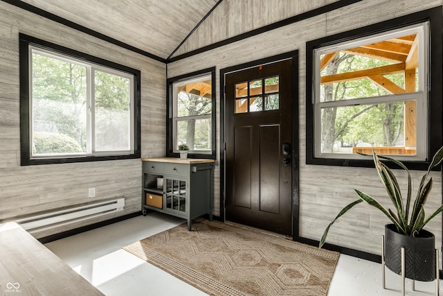 entrance foyer featuring lofted ceiling, a baseboard radiator, wooden walls, wooden ceiling, and concrete flooring