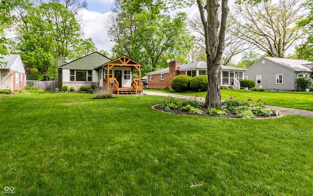 view of front of home featuring a sunroom