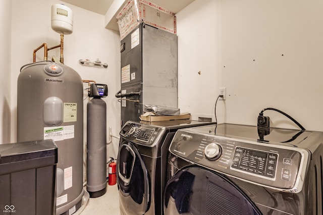 laundry area featuring washer and clothes dryer and water heater