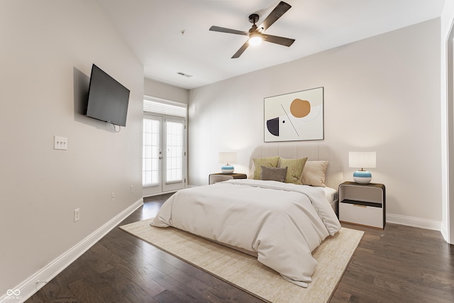 bedroom with dark wood-type flooring, access to outside, baseboards, and a ceiling fan