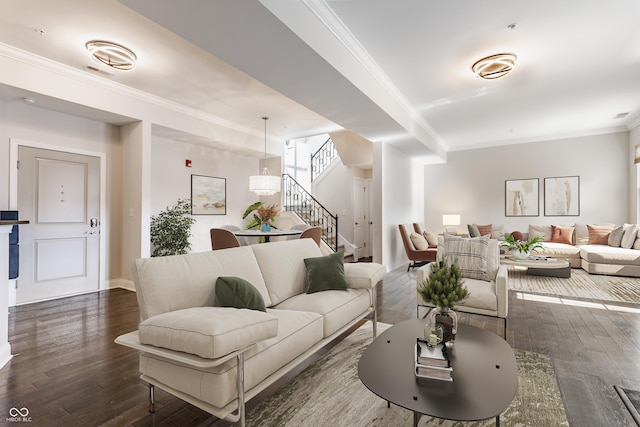 living area with stairway, dark wood-style floors, ornamental molding, and baseboards