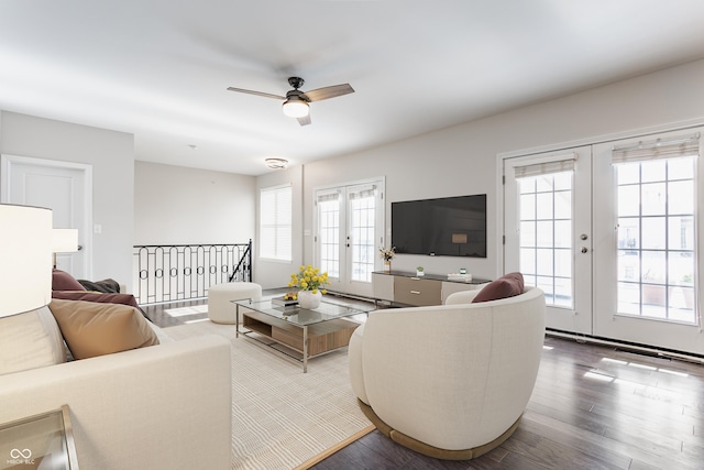 living room with wood finished floors, ceiling fan, and french doors
