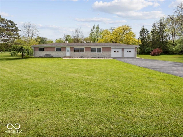 ranch-style house with driveway, a front yard, an attached garage, and brick siding