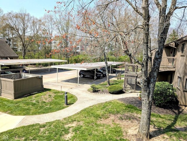 view of yard with stairway and a detached carport