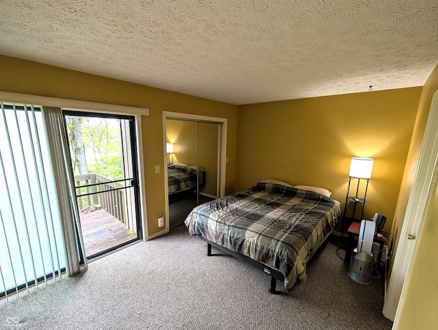 bedroom featuring carpet, access to outside, a textured ceiling, a closet, and baseboards