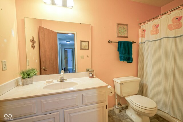 bathroom with toilet and vanity