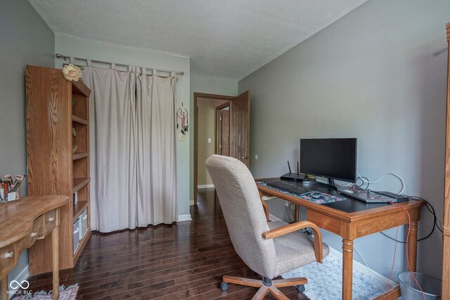 home office featuring wood finished floors, a textured ceiling, and baseboards