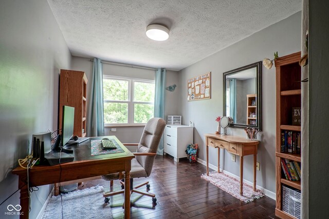 office area with dark wood-style floors, baseboards, and a textured ceiling