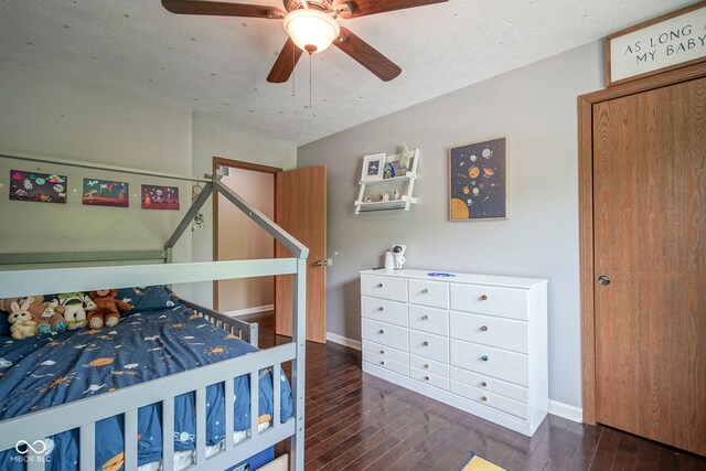 bedroom with hardwood / wood-style flooring, baseboards, a textured ceiling, and a ceiling fan