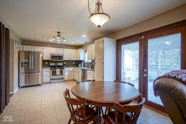 dining area with light tile patterned flooring, french doors, baseboards, and recessed lighting