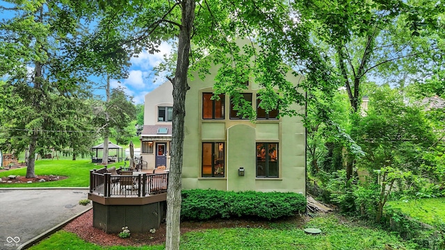 1530 E 75th St, Indianapolis, IN 46240 - townhome / multi-family property with a gazebo, stucco siding, and a front yard