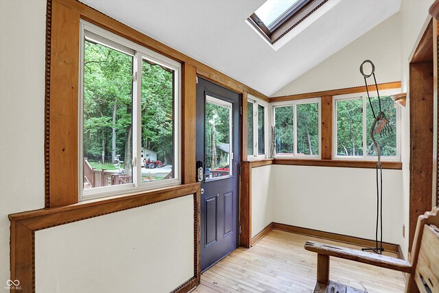 1530 E 75th St, Indianapolis, IN 46240 - unfurnished sunroom with a skylight, lofted ceiling, wood-type flooring, and baseboards