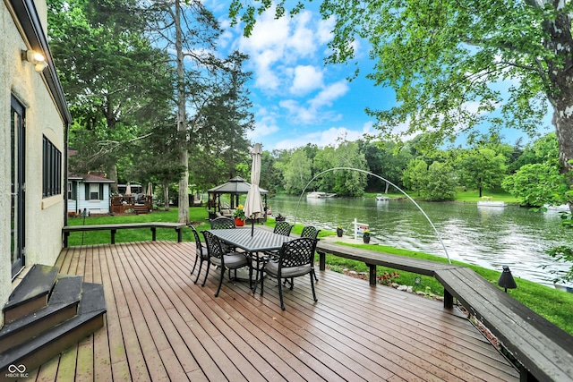 1530 E 75th St, Indianapolis, IN 46240 - deck featuring a gazebo, a water view, outdoor dining space, and view of scattered trees