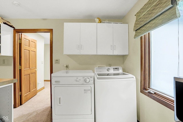 1530 E 75th St, Indianapolis, IN 46240 - laundry room featuring cabinet space, washing machine and dryer, plenty of natural light, and light colored carpet