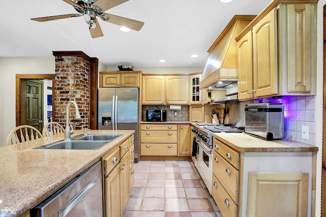 1530 E 75th St, Indianapolis, IN 46240 - kitchen with appliances with stainless steel finishes, a sink, a ceiling fan, backsplash, and custom exhaust hood