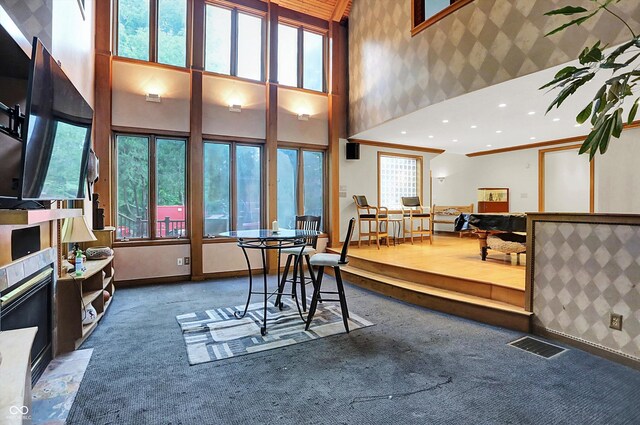 1530 E 75th St, Indianapolis, IN 46240 - dining area featuring carpet flooring, wallpapered walls, a high ceiling, and recessed lighting