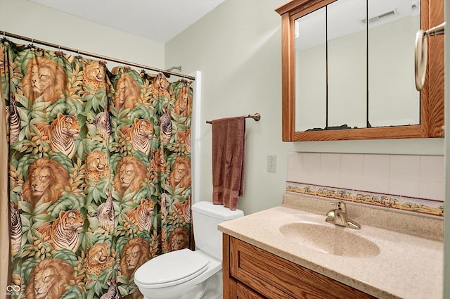 1530 E 75th St, Indianapolis, IN 46240 - bathroom featuring toilet, decorative backsplash, vanity, and a shower with curtain