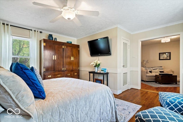 744 Gilbert Ave, Indianapolis, IN 46227 - bedroom featuring wood finished floors, a textured ceiling, ceiling fan, and crown molding