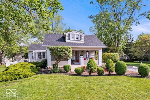 744 Gilbert Ave, Indianapolis, IN 46227 - bungalow-style home with a front yard, a porch, and roof with shingles