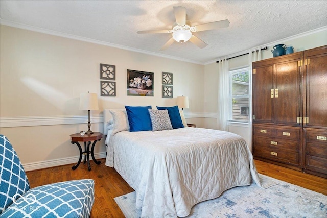 744 Gilbert Ave, Indianapolis, IN 46227 - bedroom with wood finished floors, a ceiling fan, crown molding, and baseboards