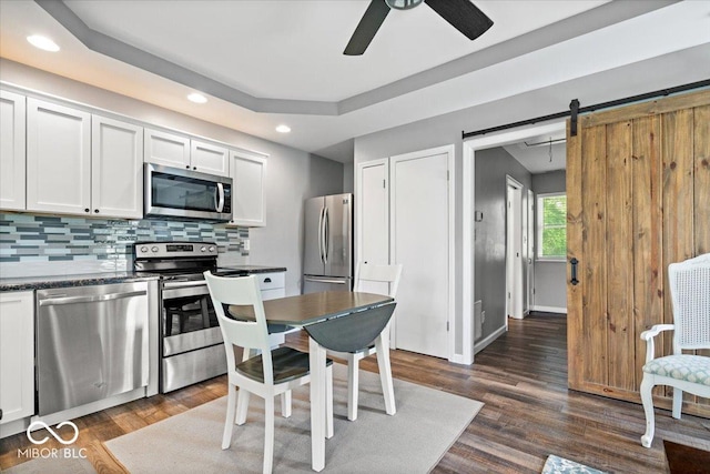 744 Gilbert Ave, Indianapolis, IN 46227 - kitchen with stainless steel appliances, recessed lighting, dark countertops, ceiling fan, and tasteful backsplash