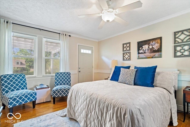 744 Gilbert Ave, Indianapolis, IN 46227 - bedroom with wood finished floors, ornamental molding, ceiling fan, and a textured ceiling