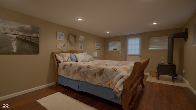 4363 E State Road 252, Franklin, IN 46131 - bedroom with baseboards, wood finished floors, recessed lighting, and a wood stove