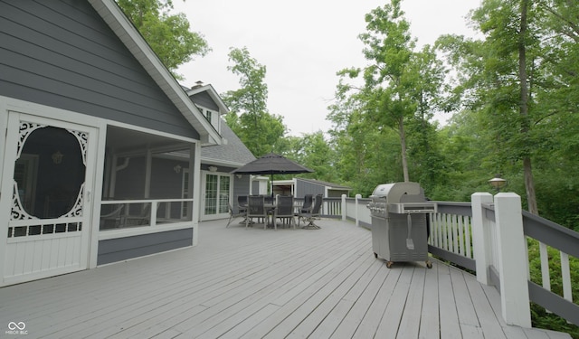 4363 E State Road 252, Franklin, IN 46131 - wooden deck featuring outdoor dining space, a grill, a sunroom, and view of scattered trees