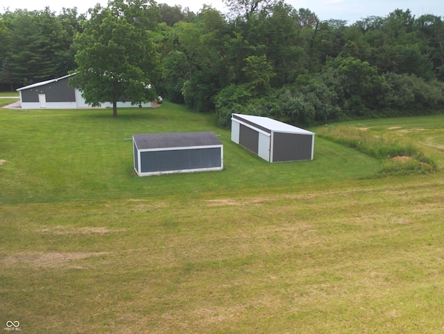 4363 E State Road 252, Franklin, IN 46131 - view of community featuring a pole building, a lawn, an outbuilding, and a wooded view