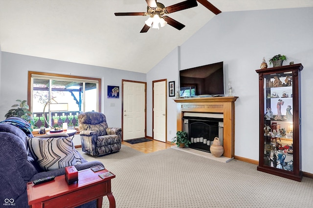 7655 N Kitchen Rd, Mooresville, IN 46158 - carpeted living area with a fireplace with raised hearth, ceiling fan, baseboards, and high vaulted ceiling
