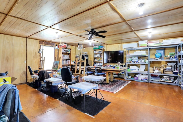 7655 N Kitchen Rd, Mooresville, IN 46158 - living area featuring wooden ceiling, ceiling fan, wooden walls, a wall unit AC, and finished concrete floors