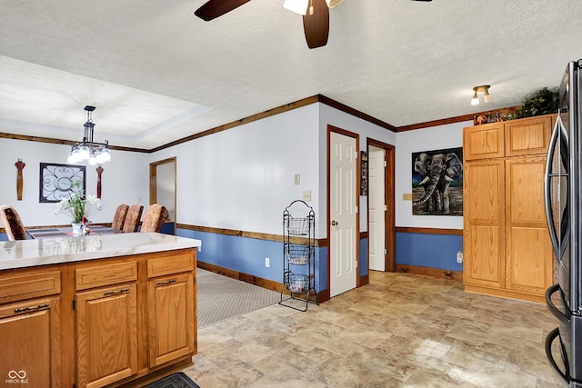 7655 N Kitchen Rd, Mooresville, IN 46158 - kitchen with baseboards, ceiling fan, light countertops, stone finish flooring, and freestanding refrigerator
