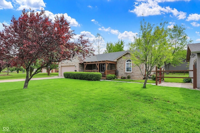 7655 N Kitchen Rd, Mooresville, IN 46158 - view of front of house with a front yard, a garage, and brick siding