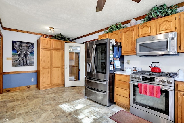 7655 N Kitchen Rd, Mooresville, IN 46158 - kitchen featuring appliances with stainless steel finishes, a ceiling fan, a textured ceiling, light countertops, and stone finish floors