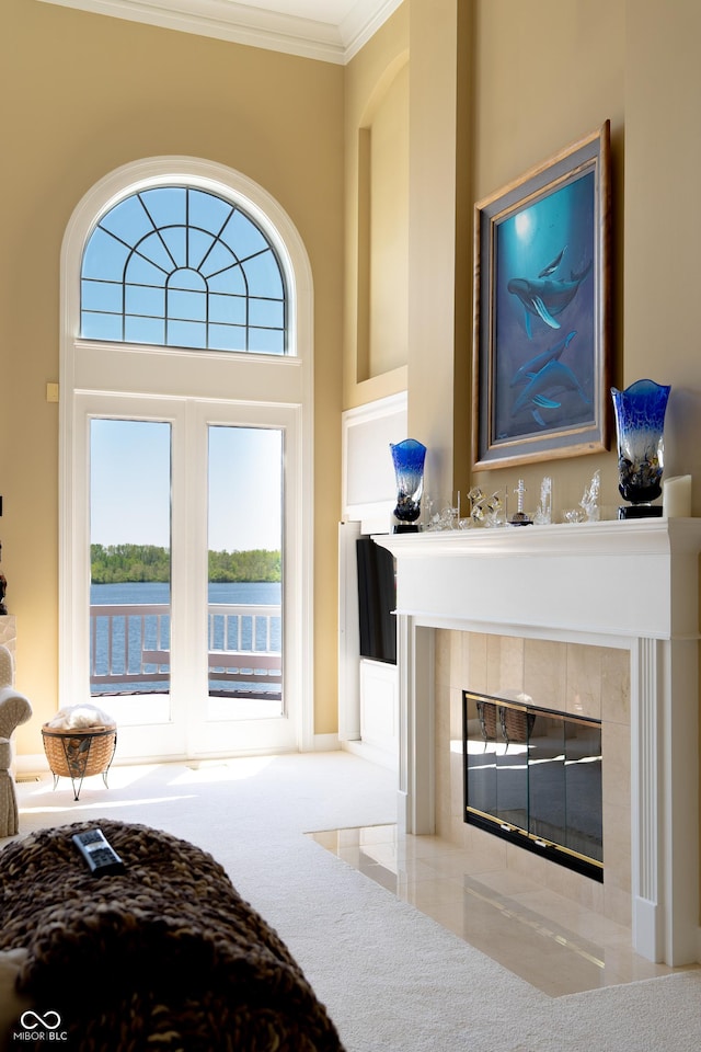 3107 Waterfront Cir, Anderson, IN 46012 - bedroom featuring a tile fireplace, crown molding, carpet, and a water view