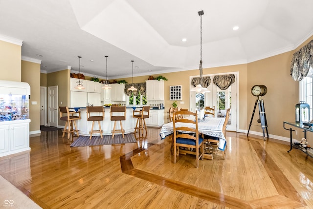 3107 Waterfront Cir, Anderson, IN 46012 - dining room featuring light wood-style flooring, baseboards, recessed lighting, and crown molding