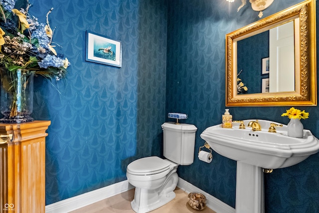 3107 Waterfront Cir, Anderson, IN 46012 - bathroom with wallpapered walls, baseboards, toilet, and tile patterned floors