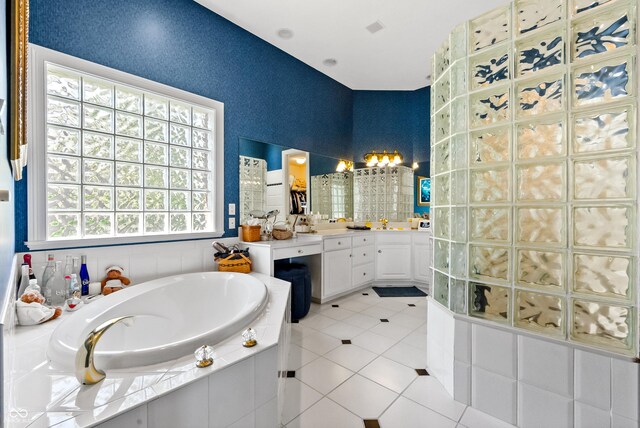 3107 Waterfront Cir, Anderson, IN 46012 - bathroom featuring a garden tub, tile patterned floors, and vanity