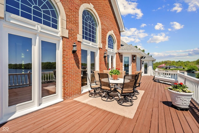3107 Waterfront Cir, Anderson, IN 46012 - wooden terrace with outdoor dining space and a water view