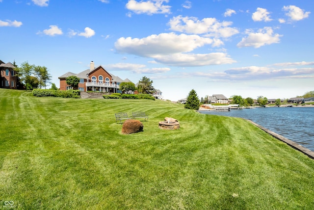 3107 Waterfront Cir, Anderson, IN 46012 - view of green lawn with a water view and an outdoor fire pit