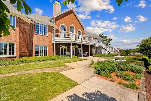 3107 Waterfront Cir, Anderson, IN 46012 - back of property with brick siding, a lawn, and a chimney
