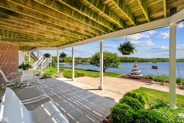3107 Waterfront Cir, Anderson, IN 46012 - view of patio / terrace with stairs and a water view