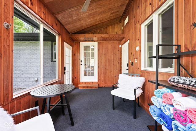 sunroom / solarium featuring lofted ceiling