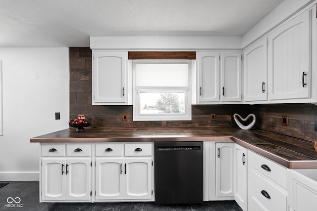 kitchen featuring dishwashing machine, white cabinets, dark countertops, and baseboards