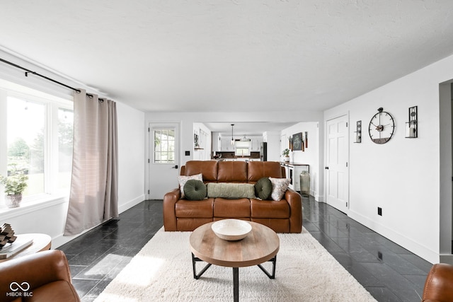 living area featuring baseboards
