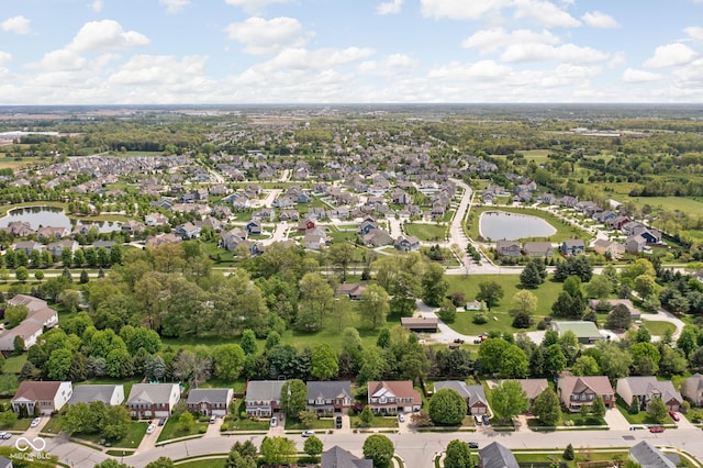 aerial view of residential area featuring a nearby body of water