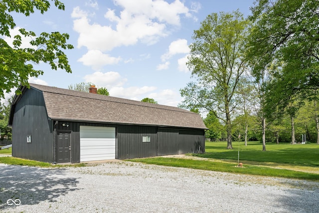 detached garage featuring driveway