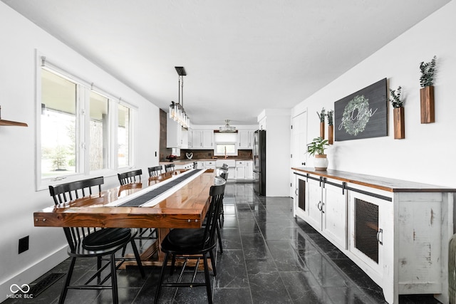 dining room with baseboards