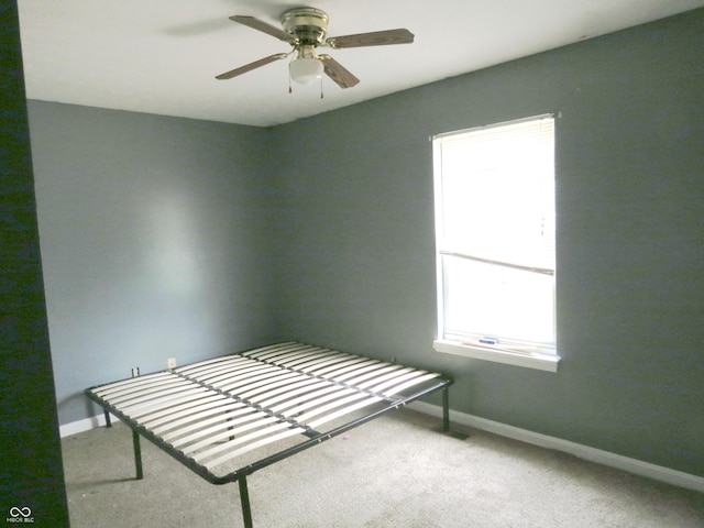 470 N Pine St, Morgantown, IN 46160 - unfurnished bedroom featuring carpet floors, baseboards, and a ceiling fan